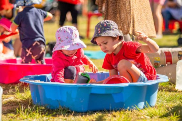 A toddler enjoying messy play